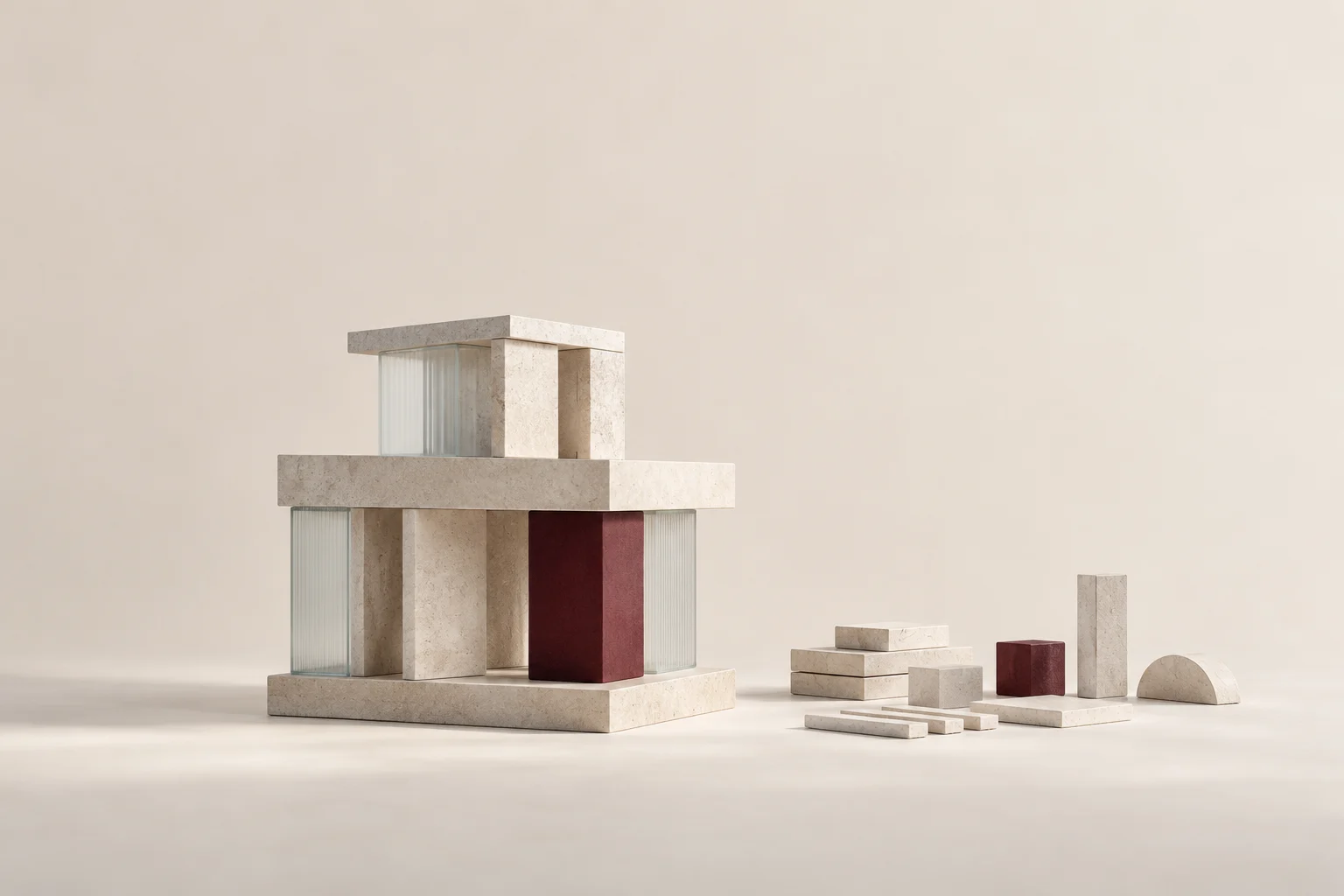 A simplified stone structure stands beside spare modules and a burgundy component.
