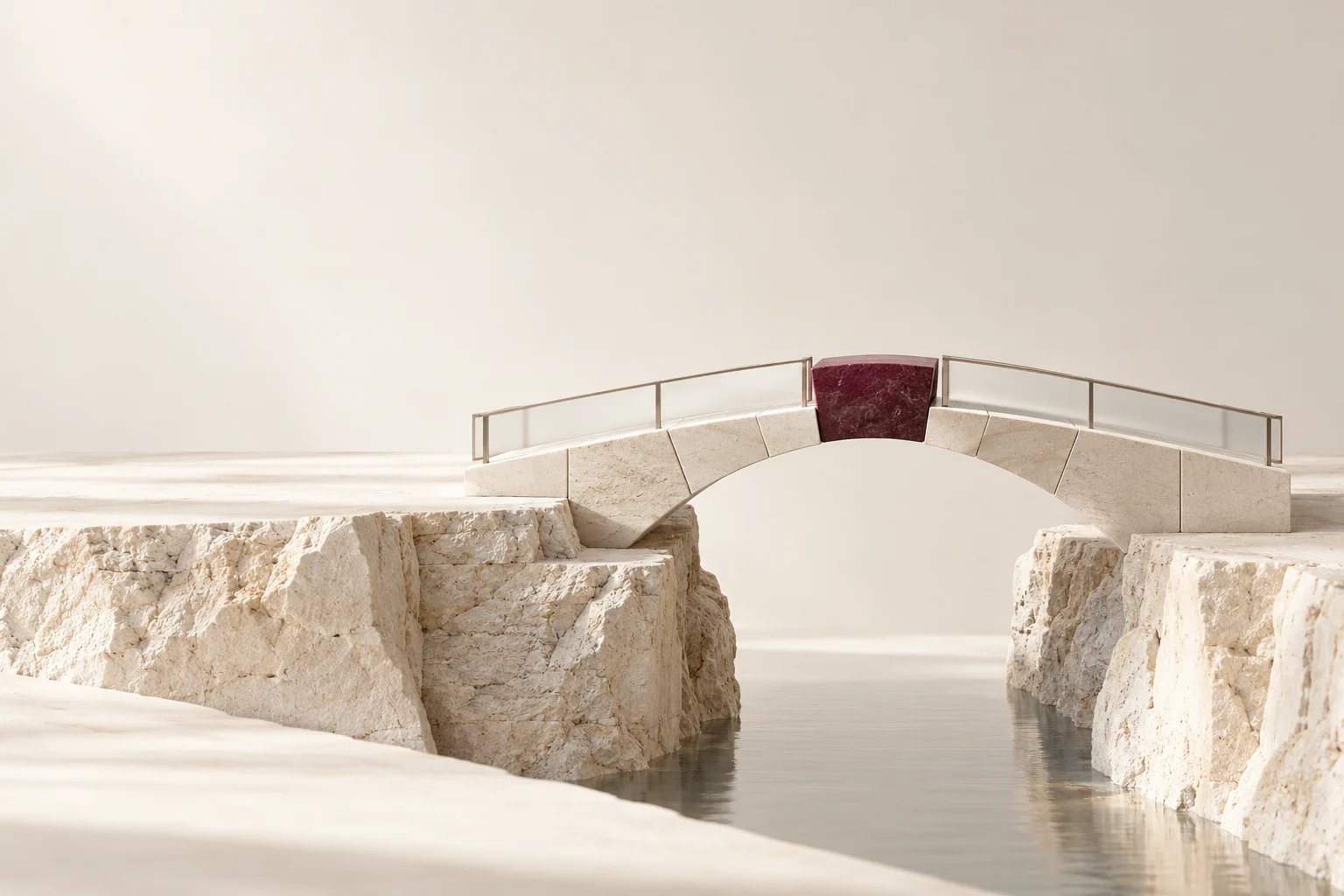 A burgundy keystone completes a pale stone bridge across a narrow gap.
