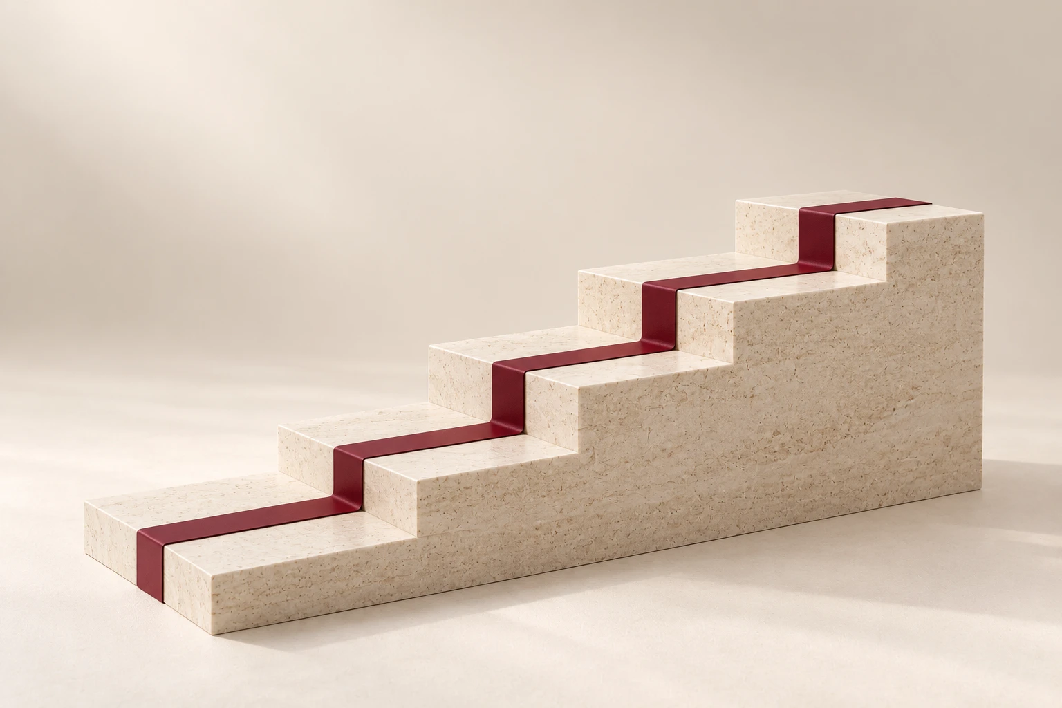 A continuous burgundy strip follows the surfaces of a solid limestone stepped platform.